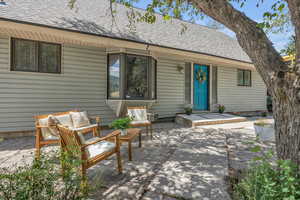 Exterior space with a patio and an outdoor hangout area