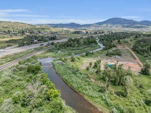 Drone / aerial view with a water and mountain view