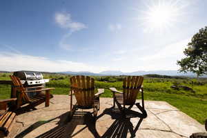 View of patio featuring area for grilling and a mountain view