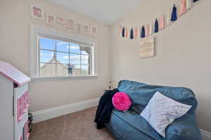 Hidden lounge behind swiveling bedroom bookshelf.