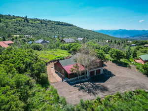 Birds eye view of property with a mountain view