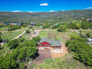 Birds eye view of property with a mountain view