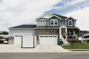 Craftsman inspired home featuring a garage