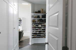 Walk in closet featuring hardwood / wood-style flooring