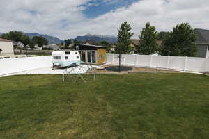 View of yard featuring a patio and a mountain view