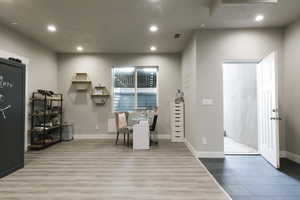 Interior space featuring a barn door and light hardwood / wood-style flooring