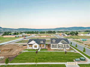 Exterior space featuring a yard and a mountain view