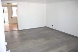 Spare room featuring hardwood / wood-style flooring