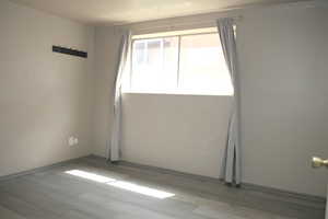 Unfurnished room featuring wood-type flooring