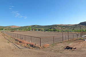 Property view of mountains with a rural view