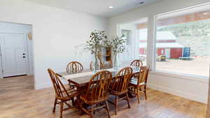 Dining area with light wood-type flooring