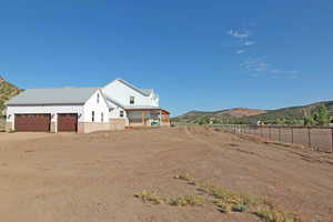 Exterior space with a garage and a mountain view