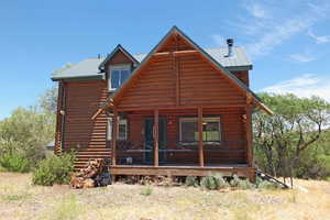 Rear view of house with a porch