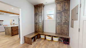 Mudroom with light hardwood / wood-style flooring