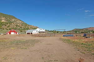 View of yard with a mountain view and a rural view