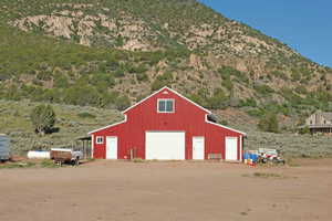 View of outdoor structure with a garage and a mountain view