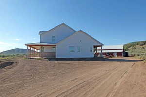 View of property exterior featuring a mountain view