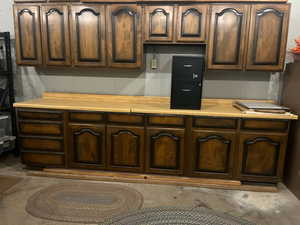 View of storage room with cabinets.