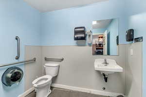 Bathroom with tile floors, sink, and toilet