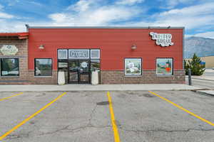 View of property with a mountain view
