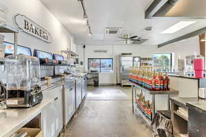 Miscellaneous room with track lighting and ceiling fan
