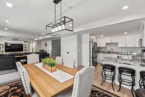 Dining room featuring sink and light hardwood / wood-style floors