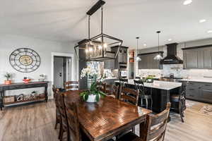 Dining area with light hardwood / wood-style floors