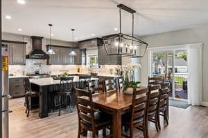 Dining space with light hardwood / wood-style flooring