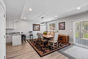 Dining area with light wood-type flooring