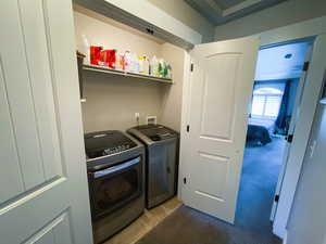 Clothes washing area featuring independent washer and dryer