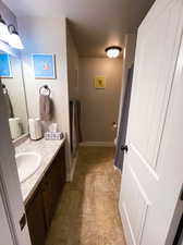 Bathroom with vanity and tile patterned flooring