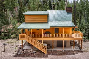 Exterior space with a deck and a patio area