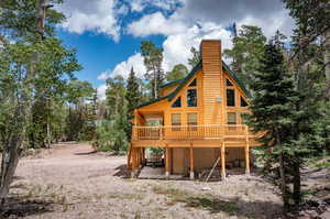 Rear view of property with a deck