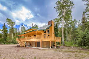 Back of house featuring a deck