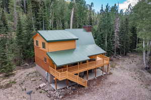 Rear view of property featuring a deck