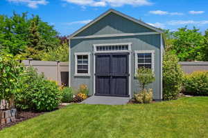 Storage shed with metal flooring and storage rack included. Lawnmower inside is negotiable