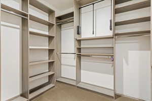 Primary Closet with custom features and design.