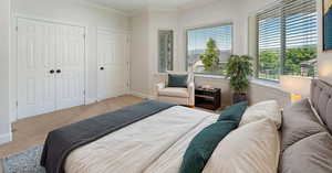 Carpeted bedroom featuring ornamental molding