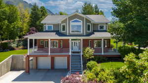 View of front of home featuring a garage and covered porch