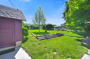 View of yard with a shed