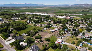 Birds eye view of property with a mountain view