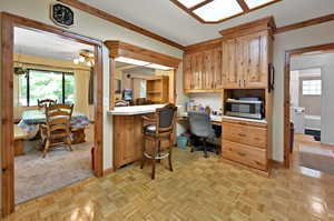 Office featuring light parquet flooring and ceiling fan