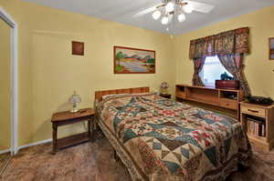 Bedroom with carpet and ceiling fan