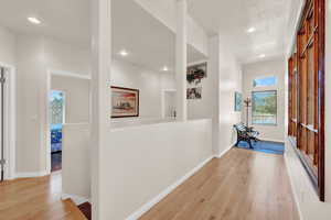 Hallway with light wood-type flooring