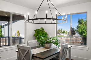 Dining room featuring a notable chandelier and plenty of natural light