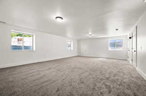 Unfurnished room with carpet