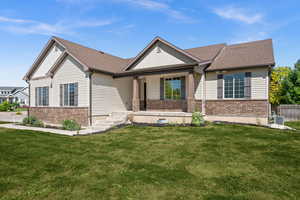 Craftsman-style home with a front lawn