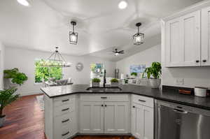 Kitchen with plenty of natural light, sink, dishwasher, and pendant lighting