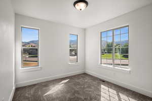 Empty room featuring carpet flooring