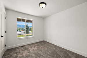 View of carpeted spare room